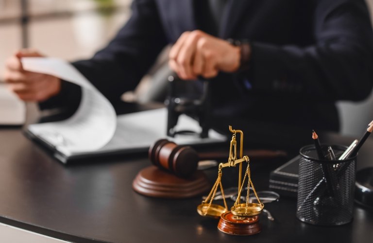 Legal documents and scales of justice on a desk